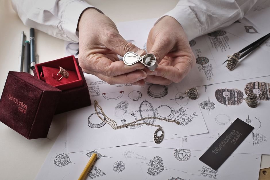can experts tell fake crystals instantly — jeweler holding a loupe over a workbench, ready for a quick inspection