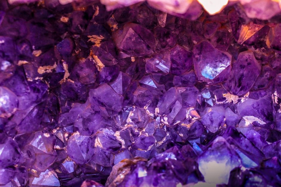 how to spot fake amethyst — natural amethyst cluster with uneven purple color and clear patches