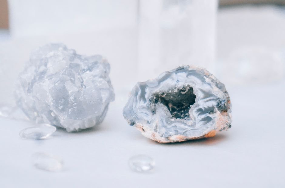 Should I Keep Both Halves of a Crystal — A Matched Pair on Display Two pale blue geode pieces displayed side by side as a matched pair