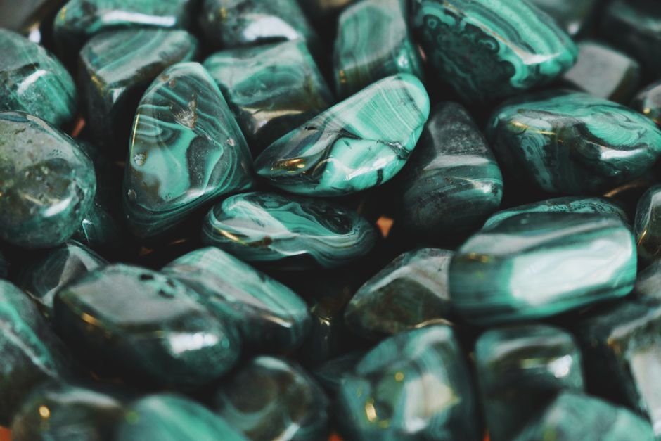 Can You Bury Any Crystal — Why Malachite Should Stay Out of the Garden Polished green malachite tumbled stones, a copper-bearing crystal that should never be buried in damp soil