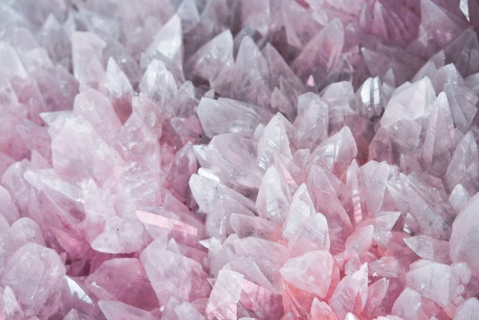 fake vs natural rose quartz — translucent pink rose quartz crystals showing the cloudy internal structure of the real stone