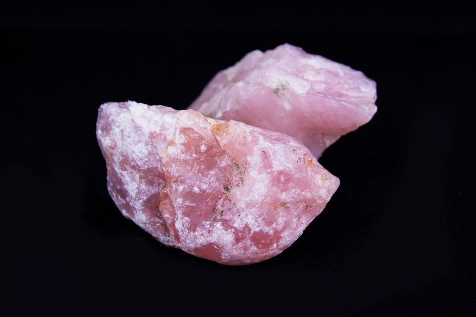 can you still use a broken crystal — two rough broken pieces of rose quartz on a black background