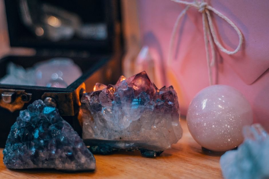 why are fake crystals everywhere — shop display of amethyst clusters and polished spheres in the booming crystal market