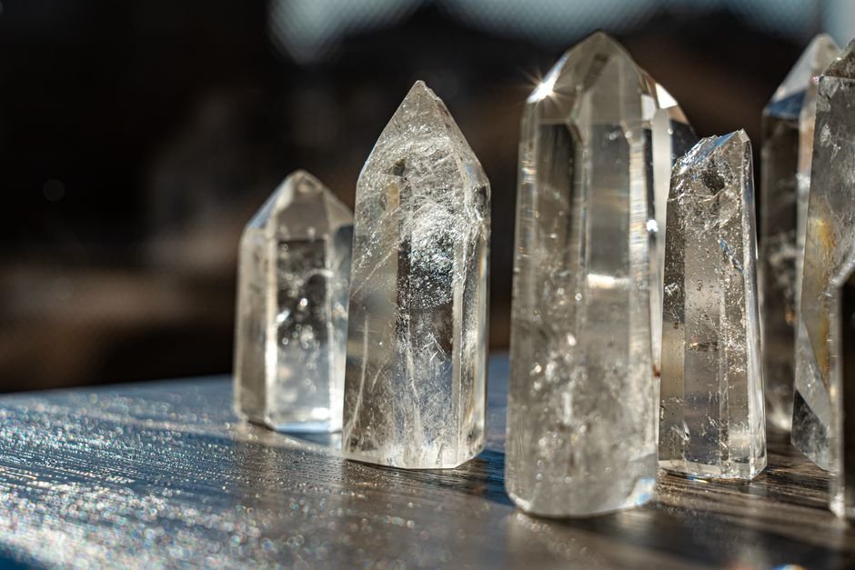 Clear quartz crystal towers reflecting sunlight, the mineral tested in crystal healing placebo and piezoelectric research