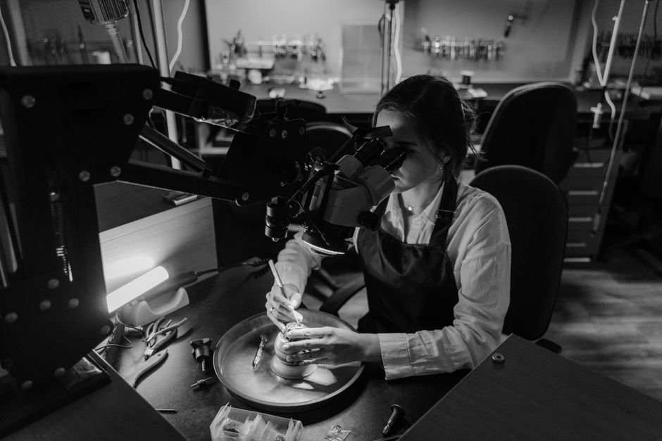 Should You Repair or Repurpose — Get a Lapidary Consultation First Jeweler working under a microscope in a workshop, the professional opinion worth getting for valuable stones