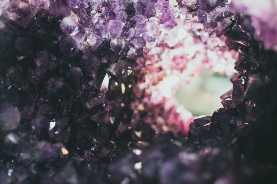 Burying a Cracked Amethyst Cluster — A Safe Stone to Return to the Earth Rough cracked amethyst geode with deep purple crystals, a water-stable quartz that is safe to bury in garden soil